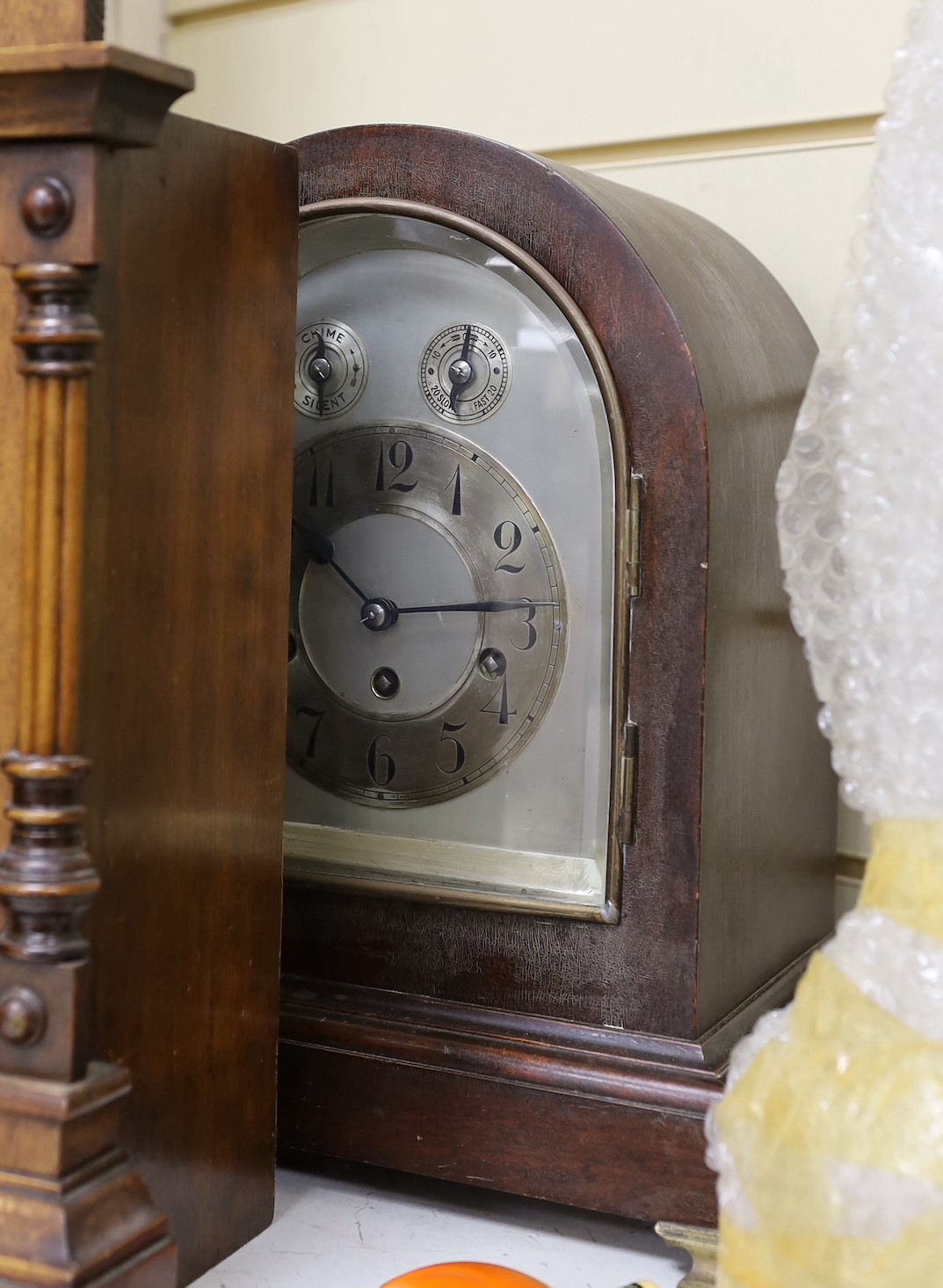 Two domed mantel clocks, a Connecticut shelf clock and a Black Forest mantel clock